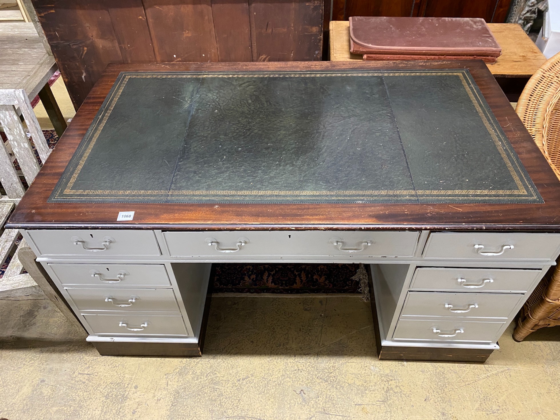 A mid 20th century mahogany pedestal desk, later painted grey, width 152cm, height 90cm